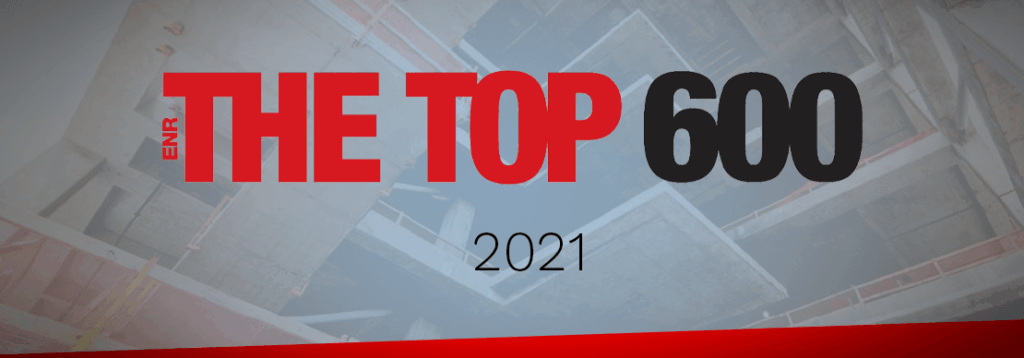 A graphic with the words ENR THE TOP 600 2021 in bold red and black text over a background showing a partially constructed concrete building.