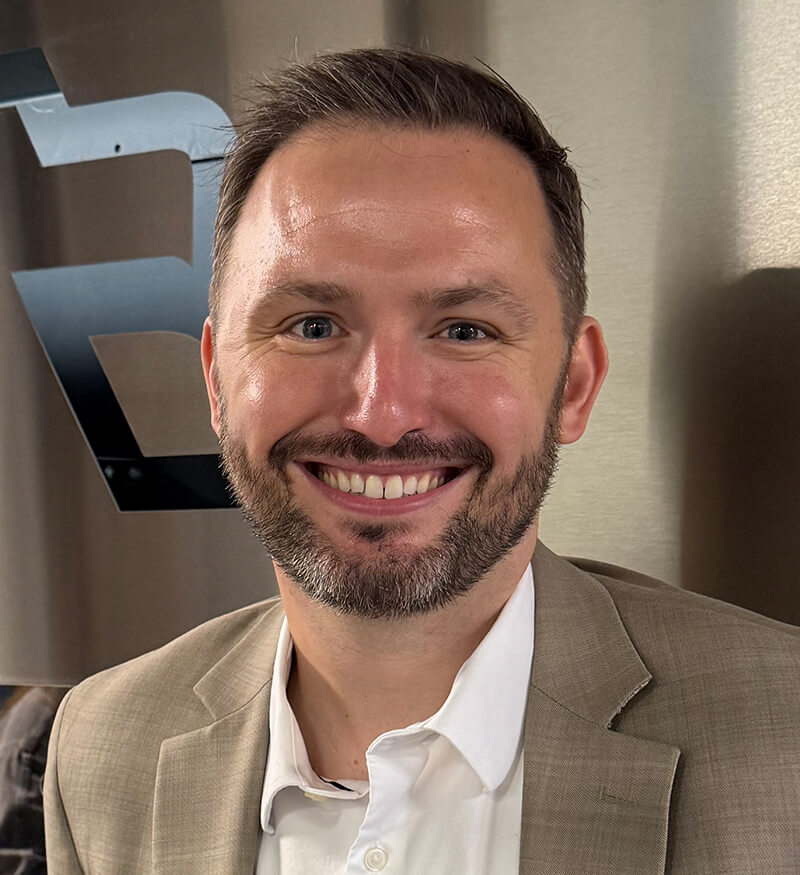 A man smiling at the camera.